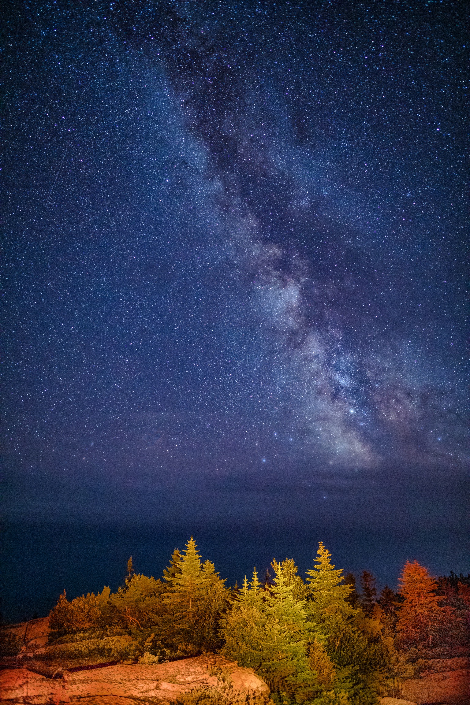 Our own milky way adding glamour to Earth’s landscape. Acadia National Park Maine showing Galactic Center Milky way.Light painting perform in foreground. Our own milky way adding glamour to Earth’s landscape. Acadia National Park Maine showing Galactic Center Milky way.Light painting perform in foreground.