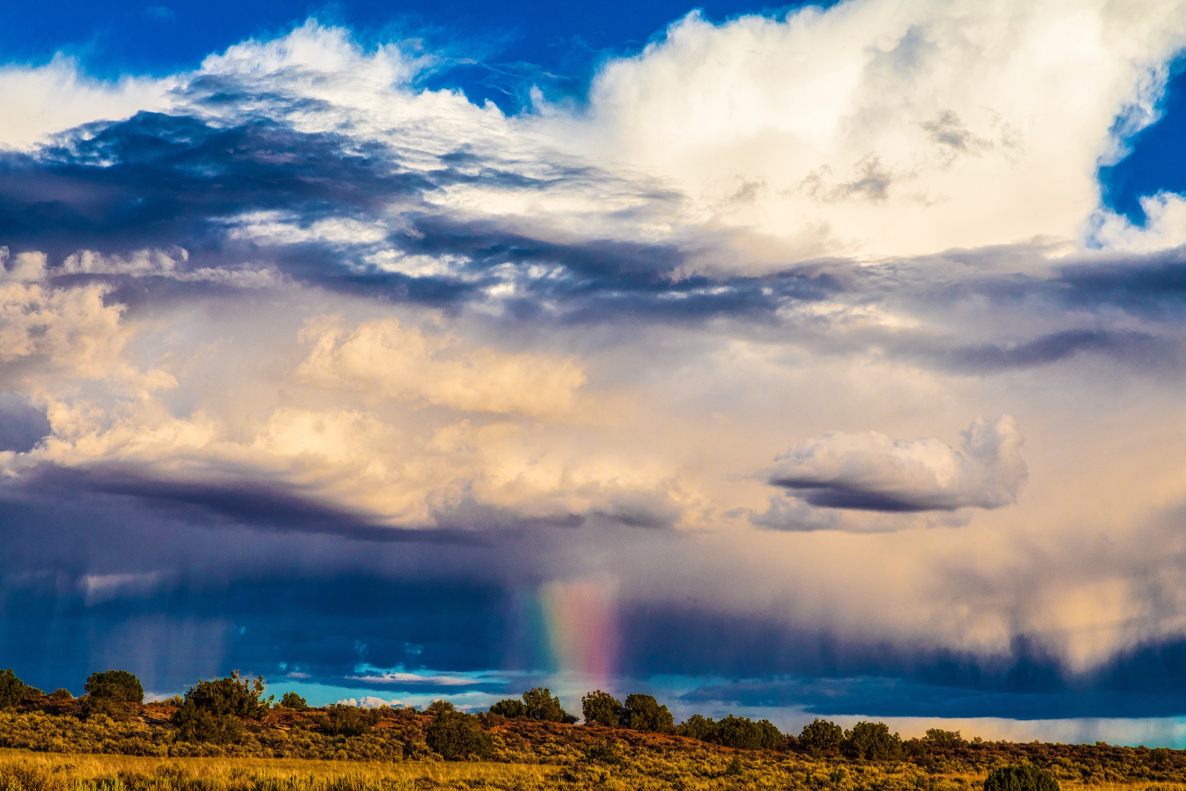 A rainbow is a promise of sunshine after rain. Arches Park Utah. A rainbow is a promise of sunshine after rain. Arches Park Utah.