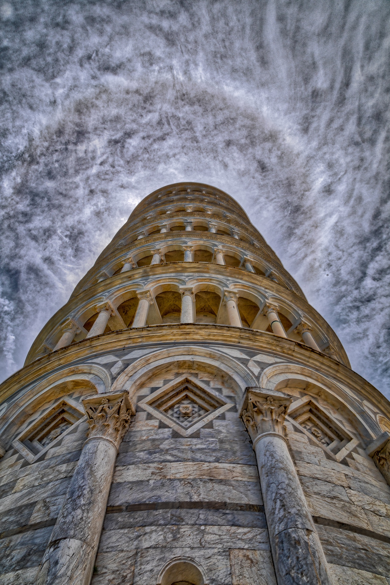 Capturing halo of clouds on top of Pisa tower, Italy. Capturing halo of clouds on top of Pisa tower, Italy.