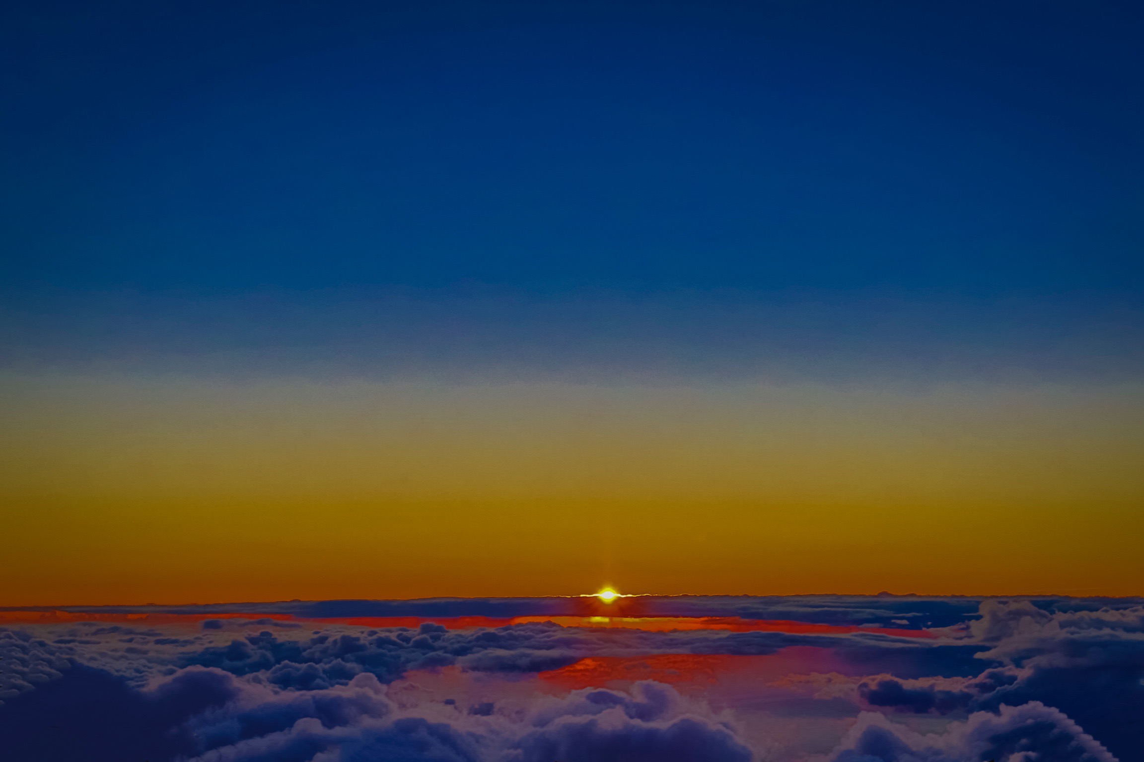 Sunset at “Monakea Hawaii”, observed at the height of the mountain above clouds. Sunset at “Monakea Hawaii”, observed at the height of the mountain above clouds.