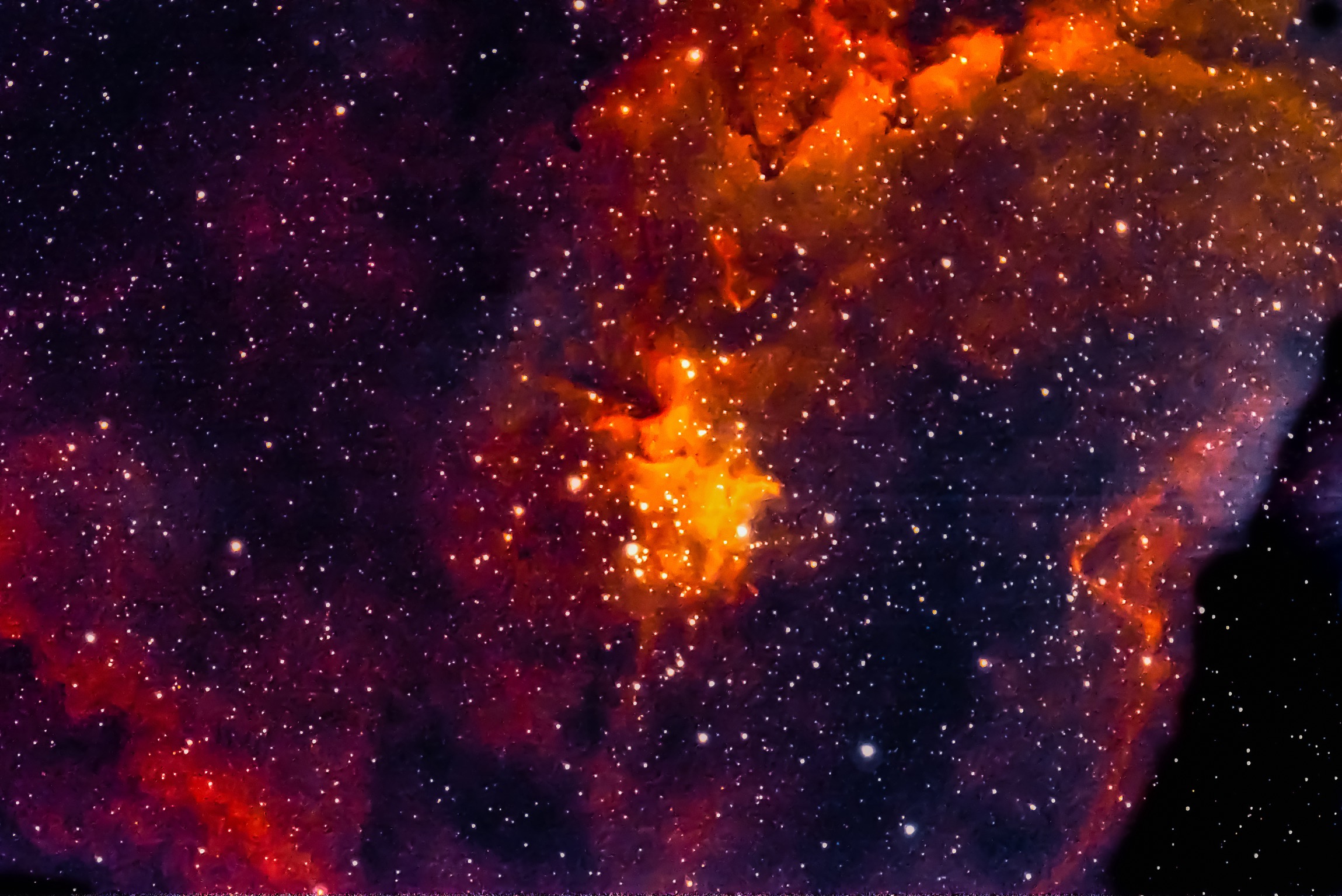 7500 light years away.Nebula’s color depends on its chemical composition and degree of ionization. Due to hydrogen in interstellar gas and low energy of ionization many emission nebulae appear red due to strong emissions.