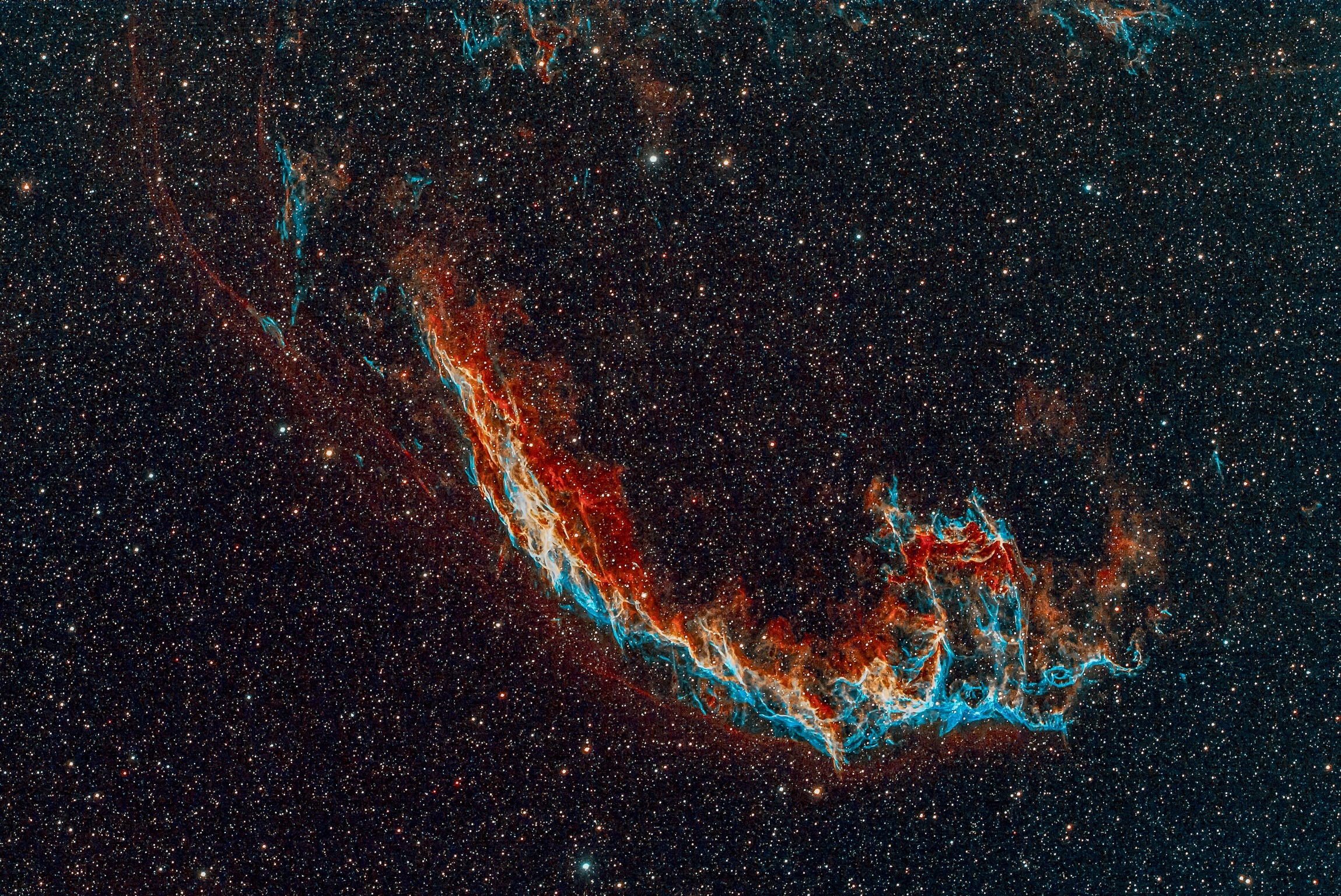 The Eastern Veil Nebula is a large supernova remnant in the constellation Cygnus. It is an expanding cloud created by the death of an exploded star. Scientists believe that the light from this supernova explosion reached Earth about 5000 years ago.