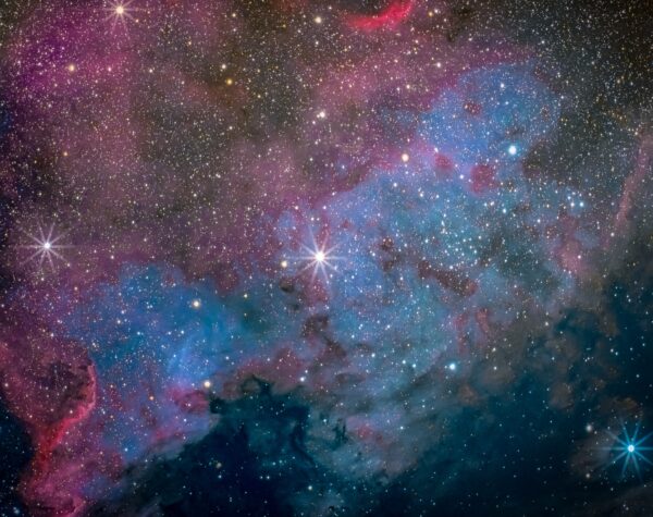 More a photographer’s dream shot than a visual treat, this is North America Nebula. The glowing gases and dark nebulae resembles the North American continent almost explicitly. Visually it can be spied through binoculars under a dark sky with averted vision, standing out as an enhanced region in the Milky Way.