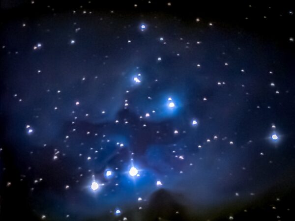 The Running Man Nebula, also known as NGC 1977, vaguely resembles a colorful space ghost sprinting through the stars in the Orion constellation. Located 1,600 light-years away from Earth, this cloud of interstellar dust and gas shares its cosmic neighborhood with two smaller nebulas, NGC 1973 and NGC 1975.